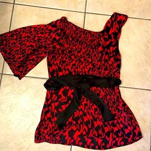 Woman’s red satin animal print blouse